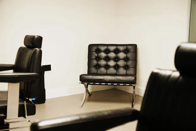 A black leather chair in the waiting area